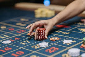 live casino baccarat table with professional dealer and cards